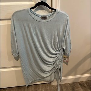 Women’s large Wrangler pale blue blouse new with tags.